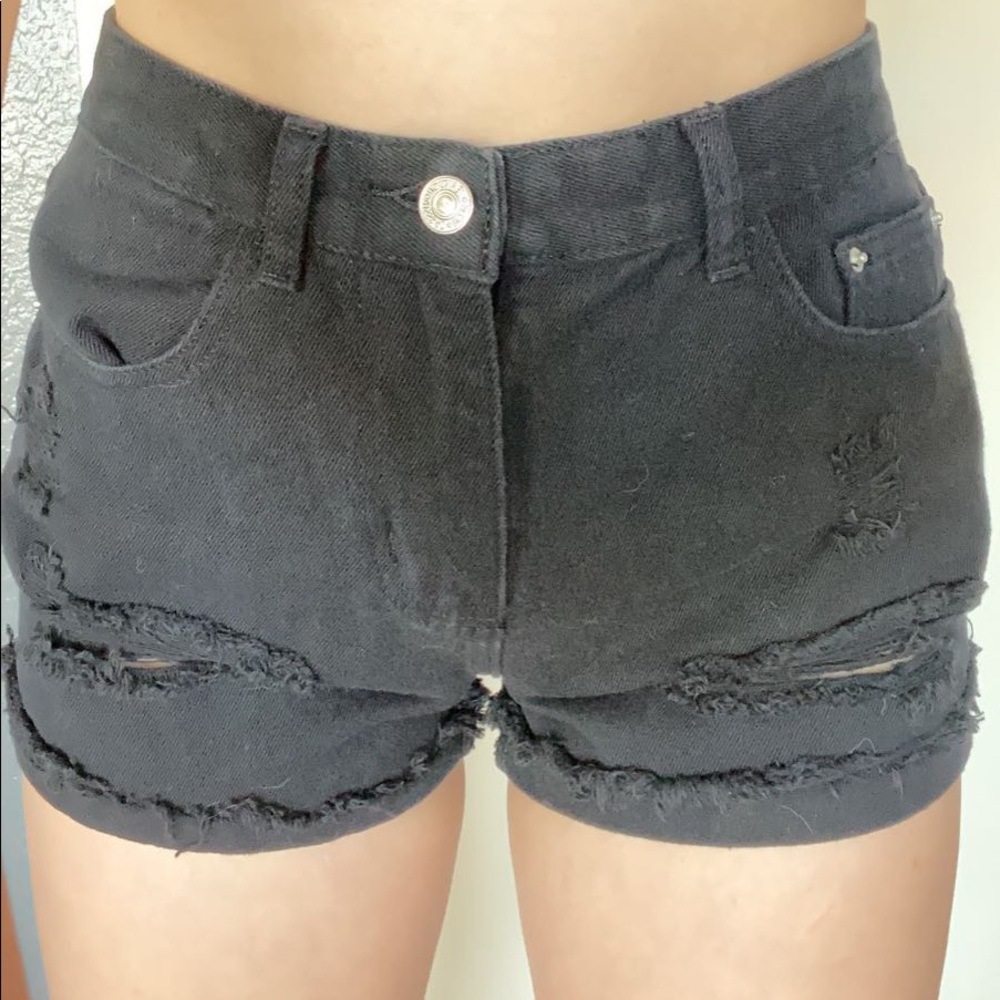 black ripped jean shorts